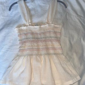 Textured peplum top with subtle rainbow stripes from Madewell.